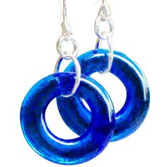 STUNNING, glowing glass hoops in an almost liquid looking color from vintage glass. The broken bottles and dishware have been taken from the old glass dumps, ground and fired into beautiful glass hoops that measure approx. 3/4" across (just a tiny bit smaller than a quarter) and hang from surgical steel ear wires. Lightweight and comfortable, weighing 0.1 ounces (the same weight as a dime). Each piece includes "The Story of the Glass" detailing the history and age of the glass used. Available in Pennsylvania Amish Country, Green Beer Bottles, Ponds Cold Cream, Broken Bottle, Vintage Jewelry Repurposed, Blue Mason Jars, Cobalt Glass, Repurposed Jewelry, Amish Country