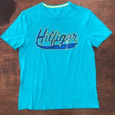 Tommy Hilfiger T Shirt Sz Large Tommy Hilfiger Green Cotton Tops, Casual Green Tommy Hilfiger Tops, Tommy Hilfiger Blue Summer Shirt, Tommy Hilfiger Blue Summer T-shirt, Tommy Hilfiger Blue Short Sleeve Shirt, Blue Tommy Hilfiger T-shirt With Letter Print, Tommy Hilfiger Blue T-shirt With Letter Print, Tommy Hilfiger Graphic Print Short Sleeve Shirt, Tommy Hilfiger Blue Short Sleeve Tops