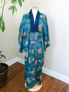 Vintage fine wool kimono, blue with wheels print, all hand stitched.  Material: Fine wool Condition: perfect vintage condition Age :  1960 - 1970sSee last photo for size. To ensure your correct fit, you can compare these measurements to a similar item that fits you well, or your own personal measurements. Please see the measurements below to ensure an accurate fit. Measurements are taken in inches.Please let me know if you need further measurements or have any questions. I'm more than happy to a Blue Bohemian Robe With Kimono Sleeves, Traditional Long Blue Kimono, Blue Long Sleeve Vintage Kimono, Wool Kimono, Womens Overalls, Ted Baker Dress, Bodycon Cocktail Dress, Kimono Pattern, Perfect Coat