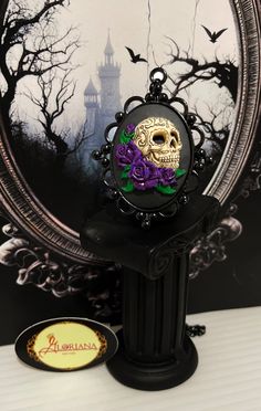 "The perfect accent to your outfit! - These Skull and Roses pendants are carefully hand detailed to create a look that will stand out amongst the rest! - The Rose colors currently come in Yellow, Blue, Red, Pink and Purple! (See our other listing for Yellow, Blue and Red!) -*MESSAGE ME IF YOU WOULD LIKE THE PINK AND OR PURPLE IN THE GOLD TONE BACKING!* - The Cameo's are set in a Black Plated Decorative Bezel.   - They come with a Black Plated Stainless Steel cable chain. DIMENSIONS: PENDANT BACK Skull Jewelry For Day Of The Dead Party, Skull Shaped Jewelry For Day Of The Dead Party, Purple Halloween Jewelry Gift, Skull Print Necklace For Halloween Gift, Day Of The Dead Skull Jewelry Gift, Gothic Skull Print Necklace For Gifts, Gothic Purple Necklace For Halloween, Gothic Purple Jewelry For Halloween, Black Jewelry For Day Of The Dead Gift