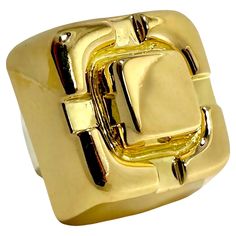 This vintage David Webb treasure is truly monumental in size and scale. The visceral impact that it makes is undeniable. Crafted as one solid piece of highly dimensional 18k yellow gold, it is very simple and at the same time it makes a strong statement. The design area measures a full 1 inch in diameter and rises 5/8 inches above the finger. Inside the ring is a white gold sizing spring stamped with WEBB, copyright, registration marks, and 18k. Ring is size 4 3/4. Gross weight 29.50 grams. Modern Yellow Gold Collectible Rings, Hallmarked Modernist Yellow Gold Jewelry, Modernist Hallmarked Yellow Gold Jewelry, Luxury Polished Yellow Gold Dome Ring, Modernist Yellow Gold Rings For Formal Occasions, Luxury Gold Signet Ring Collectible, Modern Gold Collectible Jewelry, Modern Gold Jewelry For Collectors, Classic Gold Dome Ring Collectible