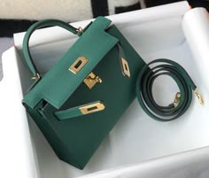 Description HRMS Kelly 19 Green With Gold Toned Hardware Bag For Women, Handbags, Shoulder Bags 7.5in/19cm Rep 1:1 Size: 19 x 11.5 x 5.5 cm / 7.5 x 4.5 x 2.2 inches (Length x Height x Width) Hermès bags are considered the ultimate luxury item worldwide. Each piece is handcrafted with waitlists that can exceed a year or more. The streamlined and demure Kelly style is always in high demand, it is particularly lovely in this vibrant version with gold hardware. Epsom is textured with a wonderful gra Mini Kelly, Hermes Kelly Bag, Pop Color, Kelly Bag, Dubai Mall, Hermes Handbags, Luxury Products, Hermes Bags, Green Bag