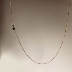 Featuring a .05 carat solitaire diamond, attached by a .03 carat black solitaire diamond, both set in 14k gold bezel settings and soldered two inches from the center. Available in 14k white, yellow or rose gold. Sizes 15 - 18 inches *18k gold and custom sizes are available upon request Minimalist Mangalsutra, Ruby Jewelry Ring, Mangalsutra Chain, White Diamond Necklace, Black Diamond Necklace, Black Beads Mangalsutra, Minimalist Necklace Gold, Daily Wear Jewellery, Gold Mangalsutra Designs