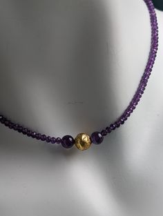 Experience the captivating allure of the Amethyst Glow Necklace. Handcrafted with exquisite attention to detail, this elegant piece features stunning amethyst gemstones complemented by hand-gilded 23 karat gold leaf on lava stone beads With its 17-inch length and 14 karat gold-filled toggle clasp, this necklace exudes timeless sophistication and adds a touch of enchantment to any outfit. Embrace the magic of the Amethyst Glow Necklace and radiate elegance wherever you go. Amethyst is a fascinati Gold Amethyst Jewelry With Gemstone Beads, Gold Amethyst Jewelry With Stones, Amethyst Gold Jewelry With Gemstone Beads, Gold Fusion Style Natural Gemstones, Elegant Amethyst Rondelle Jewelry, Elegant Gold Gemstones With Beads, Yellow Gold Amethyst Jewelry With Natural Stones, Elegant Gold Gemstones With Gemstone Beads, Handmade Gold Necklace With Amethyst