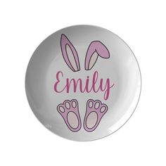 a white plate with pink bunny ears and the words,'family'on it