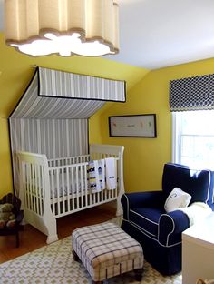 a baby's room with yellow walls and blue furniture