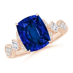 a blue sapphire and diamond ring with two diamonds on the band, set in 18k rose gold