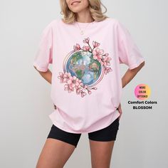 This Christian Women's Shirt features a beautiful pink floral aesthetic and an inspiring Bible verse. Made from Comfort Colors® fabric, it's a faith-based crewneck tee perfect for gifting or personal inspiration. It is perfect for travel and casual occasions. Handmade in the United States, this soft and comfy tee can be sized to fit or go two sizes up for a relaxed oversized look and feel.  Free Shipping for Orders $35.00 and Over  This program offers "free shipping" for items that are $35.00 an Spring Cotton T-shirt With Rose Print, Spring Printed Pink T-shirt, Spring Rose Print Short Sleeve T-shirt, Pink Relaxed Fit Shirt For Spring, Pink Cotton T-shirt With Floral Print, Pink Crew Neck Shirt For Spring, Pink Spring Crew Neck Shirt, Pink Floral Print Short Sleeve T-shirt, Pink Floral Print Cotton T-shirt