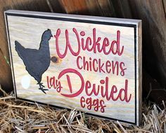 a wooden sign that says,'we walked chickens as deviled eggs '