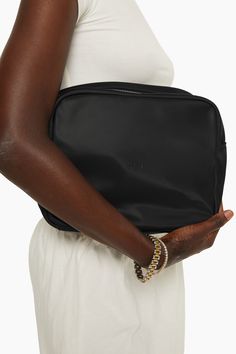 Stay organized with our Everything Bag in Onyx. This large pouch boasts an interior pocket and a zipper closure for added convenience. It's the ideal accessory for keeping your essentials in one place. On-the-go Laptop Sleeve Pouch Bag, Versatile Black Cosmetic Bag For Travel, Black Travel Bag With Zipper Pouch, Versatile Black Pouch For Travel, Versatile Black Travel Pouch, Versatile Black Bag With Laptop Sleeve, Versatile Black Bags With Laptop Sleeve, Everyday Pouch With Laptop Sleeve, Everyday Laptop Sleeve Pouch