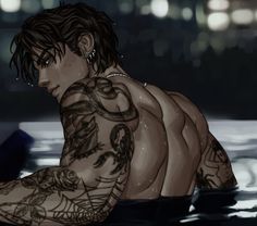 a man with tattoos sitting in the water looking down at his arm and shoulder tattoo