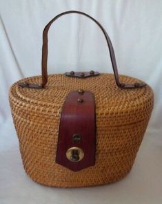 Inside is fully lined with an open slip pocket. 1960s Handbags, Vintage Exercise, Basket Handbag, Old Wicker, Historic Fashion, Large Makeup Bag, Vintage Memory, Etienne Aigner, Straw Bags