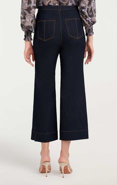 Indulge in the timeless classic, the Benji Pant. These wide-leg cropped denim jeans feature utilitarian patch pockets for a look that yours must-have. Essential for any wardrobe! Details Button flyFabric: Indigo DenimHigh risePatch pocket detail Cropped Content and Care 77% Cotton 21% Polyester 2% ElastaneDry Clean OnlyImported Measurements 26in/66.04cm, inseamMeasurements from size 4 Wide-leg Cropped Denim Jeans With Pockets, Cropped Dark Wash Flare Jeans With Pockets, Dark Wash Wide-leg Cropped Jeans With Pockets, Denim Blue Cropped Jeans With Pockets, Dark Wash Cropped Wide-leg Jeans, Workwear Cropped Denim Jeans, Chic Cropped Jeans With Pockets, Dark Wash Cropped Jeans With Pockets, Denim Cropped Leg Pants With Seam Detailing