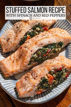 stuffed salmon with spinach and red peppers on a plate