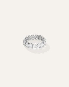 a white gold ring with five round diamonds