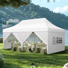 a large white tent set up on the grass