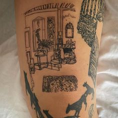 a woman's leg with tattoos on her legs and an image of a living room