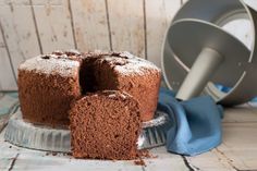 a chocolate cake with one slice cut out and the rest on top of the cake