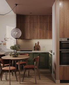 a kitchen with a table and chairs next to an oven in the middle of it