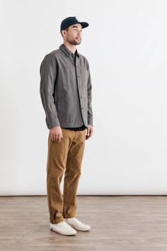 A classic button-up with two button flap chest pockets, the Eugene also features triple needle topstitching which gives it a workwear vibe. The workwear brown color way makes for an instant classic for any wardrobe. 100% Cotton Standard Fit Two notched-corner button closure chest pockets Machine wash cold in mild detergent with like colors. Line or tumble dry low. David is 6'0" and wearing size Medium. Brown Button-up Outerwear With Buttoned Pockets, Brown Collared Utility Jacket With Buttoned Pockets, Brown Utility Jacket With Lapel Collar And Pockets, Brown Single Breasted Utility Jacket With Lapel Collar, Brown Shacket With Lapel Collar And Buttoned Pockets, Classic Brown Blazer With Buttoned Pockets, Brown Button-up Utility Jacket With Buttoned Pockets, Brown Collared Utility Jacket With Button Closure, Brown Utility Jacket With Buttoned Pockets For Work