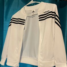 Youth 10/12 White With Black Stripe Zip Up Never Worn But Tags Aren’t On Anymore Sporty Long Sleeve Playwear Top, Sporty Long Sleeve Tops For Playwear, Casual White Tops For Playwear, Adidas Casual Tops For Playwear, Casual Adidas Tops For Playwear, White Fitted Playwear Tops, White Top With Three Stripes For Fall, White Tops For Fall Playwear, Adidas Zip Up