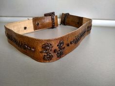 Vintage genuine leather women belt - Genuine leather belt - The belt is adjustable from 74 cm to 81 cm . Width - 4.5 cm For other VINTAGE ACCESSORIES please see here : https://www.etsy.com/shop/TheVINTAGEShopBG?ref=seller-platform-mcnav&section_id=22639651 All pictures are real . You buy exactly what you see in the photos . Thank you for visiting my store. Please check out my other items 😊 Vintage Belts With Antique Buckle, Adjustable, Vintage Leather Adjustable Belt Buckles, Adjustable Vintage Brown Belt With Antique Buckle, Vintage Brown Belt With Antique Buckle And Adjustable Fit, Adjustable Embroidered Leather Belt, Vintage Leather Belts And Suspenders With Matching Belt, Vintage Embroidered Belt For Festival, Vintage Embroidered Festival Belt, Vintage Adjustable Belts For Formal Wear