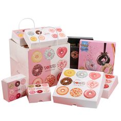 several boxes with different types of doughnuts in them, including one for donuts