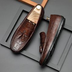 Introducing the AlliLux Leather Derby Loafers, a true embodiment of style and sophistication. Crafted with genuine cow leather, these loafers feature a stunning alligator texture that is guaranteed to catch the eye. With their slip-on closure and rubber outsole, these shoes offer both convenience and durability. Elevate your footwear game and experience superior comfort with the full grain leather insole and luxurious genuine leather lining. Don't miss out on the opportunity to make a statement Brown Oxfords With Crocodile Pattern And Round Toe, Elegant Brown Crocodile Pattern Oxfords, Business Leather Shoes With Crocodile Pattern And Slip-on Design, Business Leather Shoes With Crocodile Pattern, Brown Crocodile Pattern Dress Shoes For Business, Business Casual Loafers With Crocodile Pattern And Round Toe, Brown Leather Shoes With Crocodile Pattern For Business, Brown Crocodile Pattern Leather Shoes For Business, Business Casual Crocodile Pattern Loafers With Round Toe