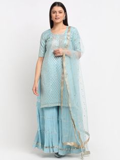 Grab this stunning Sky Blue Sharara Suit Set and just flaunt your look. The set consists of round neck, short sleeve kurti, gota work palazzos and net dupatta. Fabric-Crepe Bottom Fabric-Cotton Dupatta-Net Care-Dry Clean only. Shipping-Ships in 2-3 Weeks Short Sleeve Kurti, Sky Blue Sharara, Blue Sharara Suit, Blue Sharara, Gota Work, Palazzo Suit, Sharara Suit, Sky Color, Net Dupatta