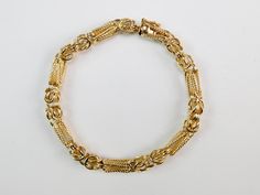 Beautiful 14K Yellow Gold Designers Rope Chain Bracelet Jewelry Attention: all jewelry is shipped with the LARGE jewelry tag.  If you remove it the item is NOT Returnable! Beautiful 14K Yellow Gold Designers Bracelet Item is gently used.  Attention international buyers!  Please check your local postal rules before buying! The transaction will be canceled if jewelry items made of gold,  diamonds, silver, etc are prohibited for shipping in your country. Antique Yellow Gold Link Bracelet, Victorian Filigree Bracelets In Yellow Gold, Victorian Style Yellow Gold Bracelets With Intricate Design, Victorian Yellow Gold Bracelet With Filigree, Victorian Yellow Gold Filigree Bracelets, Victorian 14k Yellow Gold Bracelet, Heirloom Yellow Gold Chain Bracelet, Formal Heirloom Yellow Gold Chain Bracelet, Gold Filigree Bracelet In 14k Gold