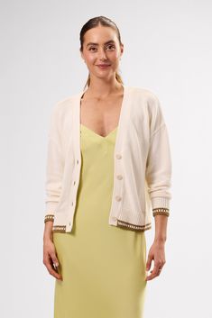 Airy, effortless, and endlessly versatile this it the lightweight cardigan you'll reach for time and again.Long-sleeved, v-neck, drop shoulder cardigan with contrasting crochet trimUrea buttons100% Organic Cotton20 3/4" in LengthEthically Made in ChinaPart of a Matching Set Everyday Cream V-neck Cardigan, Cream V-neck Cardigan For Layering, Beige V-neck Cardigan For Daywear, Cream Relaxed Fit Cardigan For Layering, Relaxed Fit Cream Cardigan For Layering, Neutral Cardigan For Spring Daywear, Neutral Spring Cardigan For Daywear, Cream Cardigan Relaxed Fit For Daywear, Cream Relaxed Fit Cardigan For Daywear