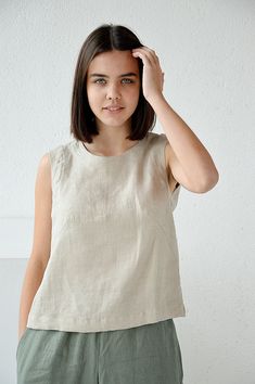 "Natural sleeveless linen top. Handmade linen basic tank top. Choose size: XS Bust 82 - 84 cm. ( 32 1/4\" - 33\") Waist 66 - 68 cm. / (26\" - 26 3/4\") Hips 90 - 92 cm. / (35 1/2\" - 36 1/4\") S Bust 86 - 88 cm. ( 33 3/4\" - 34 3/4\") Waist 70 - 72 cm. / (27 3/4\" - 28 1/4\") Hips 94 - 96 cm. / (37\" - 37 3/4\") M Bust 90 - 92 cm. ( 35 1/2\" - 36 1/4\") Waist 74 - 76cm. / (29 1/4\" - 30\") Hips 98 - 100 cm. / (38 1/2\" - 39 1/4\") L Bust 94 - 96 cm. ( 37\" - 37 3/4\") Waist 78 - 80 cm. / (30 3/4 Fitted Linen Tank Top For Everyday, Everyday Linen Sleeveless Tank Top, Everyday Sleeveless Linen Tank Top, Beige Sleeveless Linen Top, Casual Sleeveless Flax Tank Top, Sleeveless Linen Tank Top For Summer, Flax Sleeveless Top For Spring, Sleeveless Flax Tops For Spring, Spring Flax Sleeveless Top