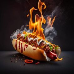 a hot dog covered in chili, mustard and ketchup with flames coming out of it