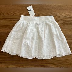 New With Tag. Size: Xs Color: White Ref 5107/242 Mini Skirt With A High Waist. Self Embroidered Detail. Scalloped Hem. Interior Lining. Hidden In Seam Zip Closure. Material: Embroidery: 100% Polyester Main Material: 100% Cotton Lining: 100% Cotton High Waist Skirt, Zara Skirts, Zara White, Scalloped Hem, Waist Skirt, Mini Skirt, High Waisted Skirt, High Waist, Womens Skirt