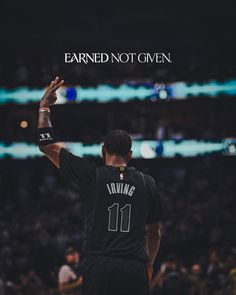 a basketball player raising his arms in the air with an inscription above him that reads, earning not given