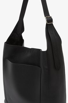 Black leather shoulder bag from The Row. The Black hobo bag is softly structured in grained calfskin leather complete with an adjustable shoulder strap, exterior back pocket, and removable interior zip pouch.Measurements: L30 x H13 x W9 cmMade in Italy Soft Pebbled Leather Hobo Bag For Daily Use, Daily Use Soft Pebbled Leather Hobo Bag, Workwear Textured Leather Bucket Bag Crossbody, Soft Pebbled Leather Hobo Bag With Double Handle, Classic Calf Leather Hobo Shoulder Bag, Textured Leather Crossbody Bucket Bag For Work, Daily Use Pebbled Leather Hobo Bag, Textured Leather Hobo Shoulder Bag, Pebbled Leather Hobo Bag With Removable Pouch