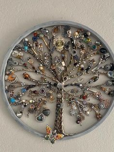 a metal tree with lots of charms on it