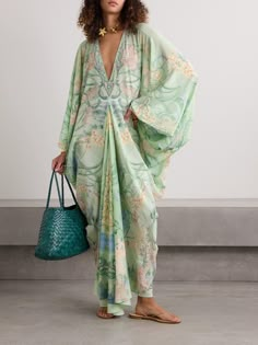 Camilla's kaftan is so effortlessly glamorous. It's made from silk-chiffon printed with colorful blooms and has a V-neckline framed by sparkling crystals. The draped batwing sleeves accentuate the loose fit. Loose Kaftan Dress, Unique Kaftan Designs, 70s Kaftan, Linen Caftan, Silk Beach Dress, Kaftan Outfit, Camilla Kaftan, Beach Kaftan Dress, Kaftan Design