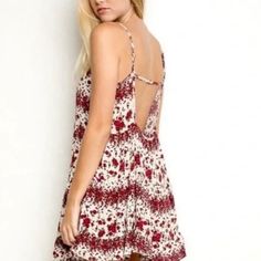 Beautiful Fitting Dress By Brandy Melville One-Size Never Worn Can Ship Out Same Day. Casual Sleeveless Rose Print Dress, Summer White Floral Dress With Rose Print, White Summer Floral Dress With Rose Print, White Floral Dress With Rose Print For Summer, Beach Mini Dress With Rose Print, Mini Beach Dress With Rose Print, Casual Rose Print Beach Dress, Flowy Red Floral Dress For Summer, Summer Mini Dress With Rose Print