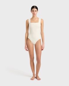 The Gwen One Piece swimsuit in Pearl features a minimal square neckline, wide comfortable straps, invisible under-bust support, removable cups and flattering gathers at the side bust. Gwen is made using our technically advanced Sculpteur® fabric that flatters and supports the silhouette. Luxury fabric sustainably made in Italy.Garment sustainably made in Australia.