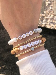 🔹This custom bracelet stack is the perfect addition to your fall wardrobe! Customize the word bracelets to say whatever you would like! 🔹They are made with 8mm howlite and wood beads, 18k gold plated beads or 18k gold filled beads and then strung together with a strong elastic cord. Gold filled beads have a much thicker layer of gold and will maintain it's color for years. You can also add a few drops of essential oils to the wood beads to get some aromatherapy throughout the day! 🔹Each custom beaded bracelet stack can be packed in a gift box wrapped in organza ribbon and a handwritten message can also be included. It makes the perfect gift for yourself or for Christmas, a baby shower, new mom, Mother's Day, bridal shower, birthday and Valentine's Day.  🔹Length: bracelets are made to a Mom To Be Bracelet, Hypoallergenic Stretch Bracelet As Gift, Casual Name Bracelet For Mother's Day Gift, Casual Stretch Bracelet With Custom Name As Gift, Casual Stretch Bracelet With Custom Name For Gift, Casual Custom Name Jewelry As Gift, Casual Custom Name Jewelry For Gifts, Mama Bracelet Stack, Mothers Day Bracelets