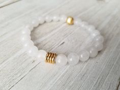 Gorgeous white stack features: -milky white with gold bead and spacers -matte white jade with matte gold hematite and gold spacers -white moonstone paired with a pink moonstone pendant. Pick one or all 3 of them. Choose your bracelet choice and your size from drop box. All your items will be packaged and shipped in a cotton filled kraft box. White Pearl Bracelet With Gemstone Beads For Spiritual Wear, White Spiritual Pearl Bracelet With Gemstone Beads, Spiritual White Pearl Bracelet With Gemstone Beads, White Minimalist Crystal Bracelet For Everyday, Minimalist White Crystal Bracelet For Everyday, Adjustable White Minimalist Crystal Bracelet, White Adjustable Minimalist Crystal Bracelet, White Beaded Minimalist Stretch Bracelet, White Gemstone Beads Stretch Bracelet As Gift