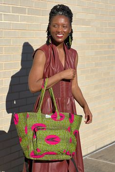 The bag that fits everything and is just everything! The Everything Bag fits all of your essentials stylishly. Handmade in Ghana from authentic Ankara. Disclaimer: Product color and quality seen may vary slightly compared to actual items due to photography lighting conditions and items being one-of-a-kind and cut from different parts of the fabric. Green Double Handle Travel Bag For On-the-go, Green Tote Weekender Bag For On-the-go, Green Travel Bag For On-the-go, Green Hobo Bag With Leather Handles For On-the-go, Green Travel Shoulder Bag, Large Capacity Pink Hobo Bag For Travel, Travel Hobo Tote Bag With Zipper Pocket, Green Rectangular Shoulder Bag For Travel, Green Rectangular Travel Shoulder Bag