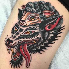 a tattoo with an image of a wolf on it