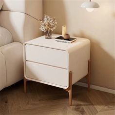 a small white table with flowers on it