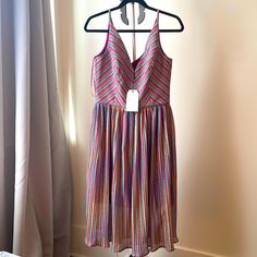 Multi-Color Fit And Flare Dress Deep V-Neck With A Scoop Back Pleated Midi Skirt Purple Lined Midi Length Dresses, Multicolor V-neck Summer Midi Dress, Pink Lined V-neck Midi Dress, Purple V-neck Sundress For The Beach, Purple V-neck Sundress For Summer, Purple V-neck Sundress For Spring, Purple V-neck Spring Sundress, Purple Summer Sundress For Parties, Lined Purple Midi Dress For Summer