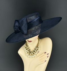 Note: The design of this hat, particularly the shallower crown, was crafted to create a unique aesthetic that suits some individuals perfectly. However, if you notice that the hat tends to slip, I would advise attaching an elastic strap to ensure a more secure and comfortable fit. ✿*.Key Features.*✿ This is a wide flat brim hat!! It's made of sinamay (3 layers ) and satin.  A nice sinamay bow is trimmed with satin ribbon too, very cool, one of my favorite hats! High quality. It's more beautiful in person! Great for Kentucky derby, weddings, church, Easter, Royal Ascot, horse races, cocktails, tea party, or any hat wearing occasion. Hat base size: From front to back: 19" (48cm) From left to right: 18.25" (46cm) Wide brim appr: 6" (15cm) Crown Depth: 3.5" (9cm) Hat girth: 21" (53.34cm). It f Luxury Blue Party Hat, Easter Hat, Sinamay Fascinator, Royal Ascot Hats, Ascot Hats, Easter Hats, Hat Wedding, Church Hat, Flat Brim Hat