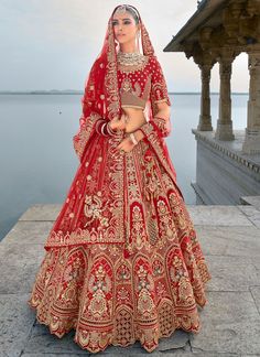 Traditional Bridal Red Silk embroidered lehenga choli AA138Desc: Style : Circular Lehenga Color : Red Fabric : Silk  Work :Haevy Embroidery Wash Care : Dry clean Sleeve Style : Half Sleeve Long Sleeves : Done only in Custom Stitch Sleeves Lining : Done only in Custom Stitch Bust Size : 32 to 42 Inches Occasion : Wedding Mehendi Engagement Reception Ceremonial Baby Shower Party Wear:Semi stitch lehenga choli.Size till 42 inch.heavy bridal lehenga choli Pink lehenga choli silk...