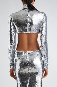 Channel disco-ball sophistication and shine in this sequin crop top that's balanced with a mock neck and long sleeves with streamlined zip cuffs. 13" Length (Size Medium) Hidden back-zip closure Mock neck Long sleeves with zip cuffs Lined 100% polyester Dry clean Made in the USA Designer Clothing Mock Neck Crop Top, Laquan Smith, Sequin Crop Top, Neck Crop Top, Disco Ball, Mock Neck, Designer Clothing, Sequin, Crop Top