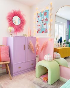 a room filled with furniture and decor in pastel colors, including pink, green, yellow, and blue